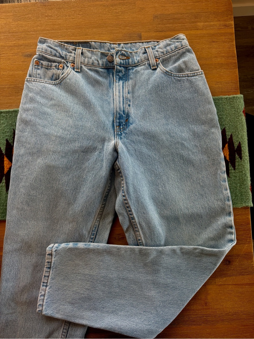Vintage Levi’s 550 light blue wash jeans.